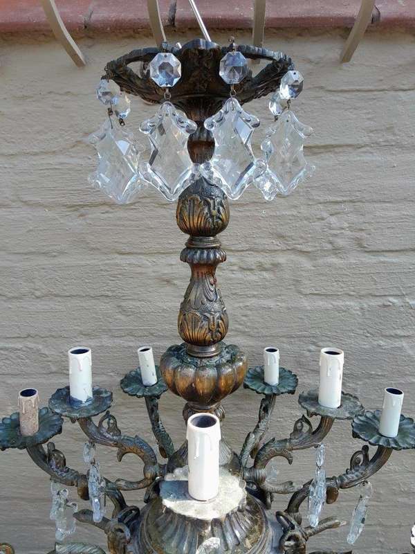 A 20th Century French Style Antique Brass and Crystal Twelve Light Chandelier