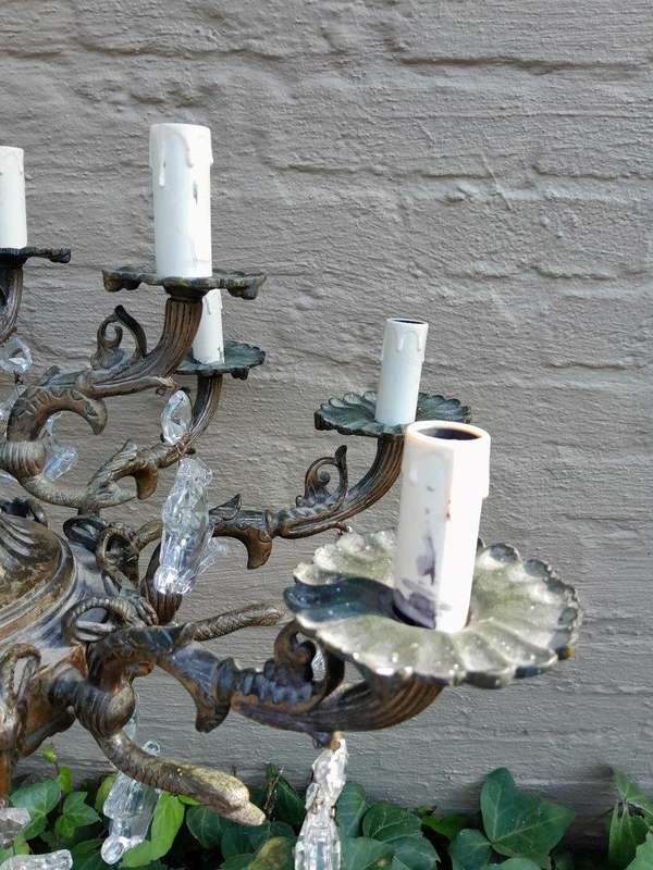 A 20th Century French Style Antique Brass and Crystal Twelve Light Chandelier