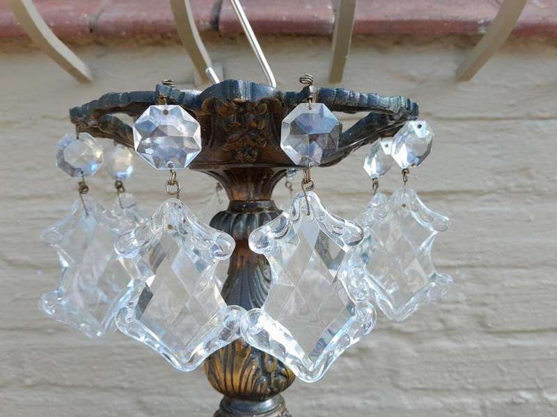 A 20th Century French Style Antique Brass and Crystal Twelve Light Chandelier
