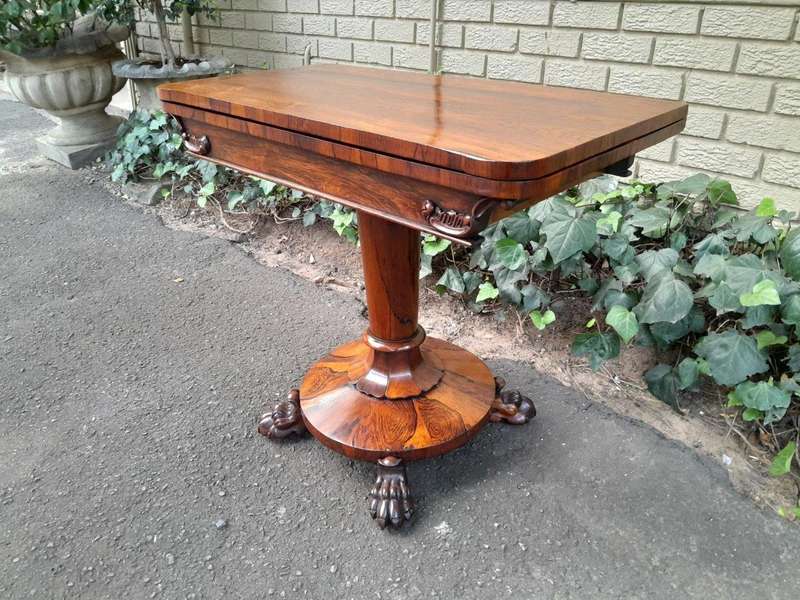 A 19TH Century William IV Rosewood Fold-over Card Table With Paw Feet