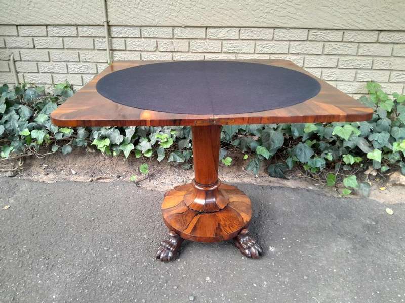 A 19TH Century William IV Rosewood Fold-over Card Table With Paw Feet