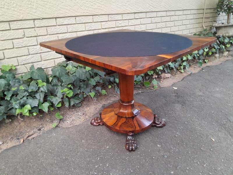 A 19TH Century William IV Rosewood Fold-over Card Table With Paw Feet