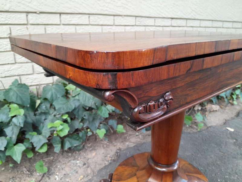 A 19TH Century William IV Rosewood Fold-over Card Table With Paw Feet