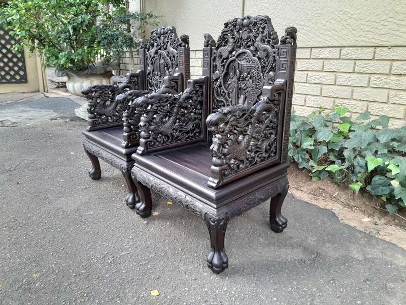 An Early 20th Century Circa 1920 Pair of Oriental Ornately Carved Throne Chairs