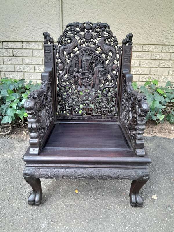 An Early 20th Century Circa 1920 Pair of Oriental Ornately Carved Throne Chairs