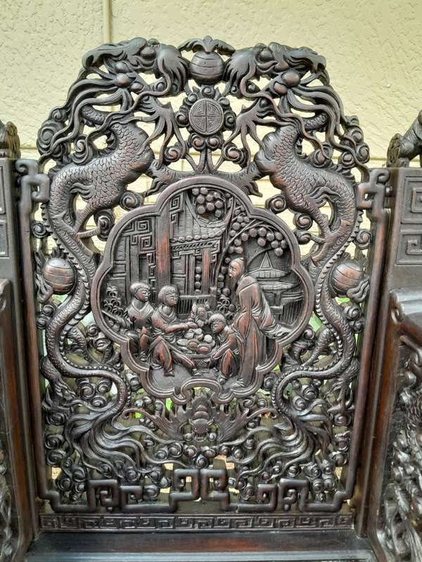 An Early 20th Century Circa 1920 Pair of Oriental Ornately Carved Throne Chairs