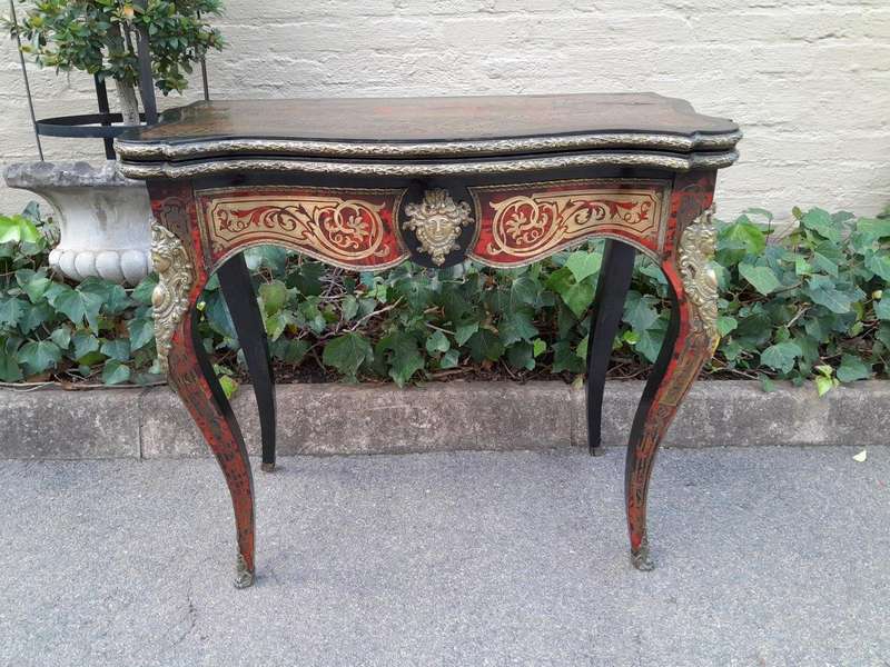 A 19th Century Boulle, Ebonised and Ormolu Mounted Cart Table