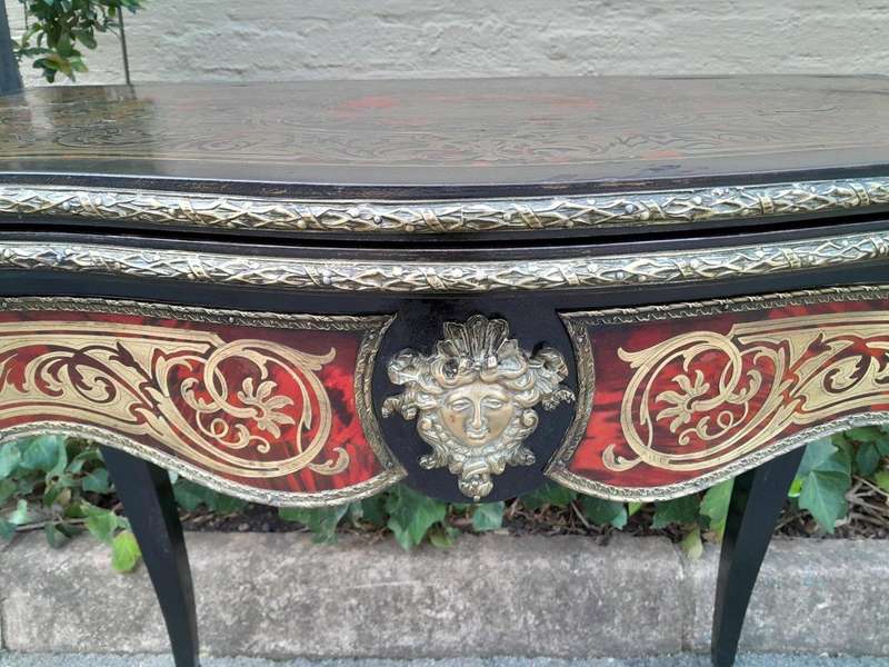 A 19th Century Boulle, Ebonised and Ormolu Mounted Cart Table