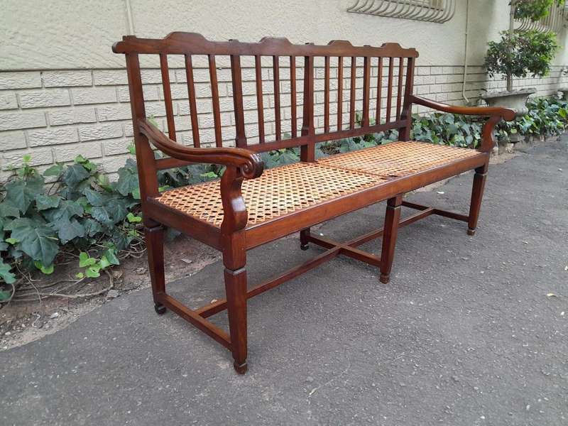 A 19th Century Cape Stinkwood Neo Classical Bench with Rattan Seat