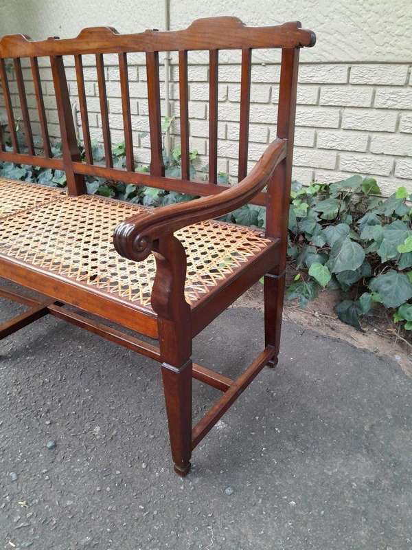 A 19th Century Cape Stinkwood Neo Classical Bench with Rattan Seat