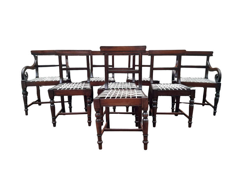 A 19th Century Set of Eight Cape Stinkwood Dining Charis with Riempie Seat Comprising Two Carvers...