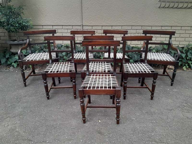 A 19th Century Set of Eight Cape Stinkwood Dining Charis with Riempie Seat Comprising Two Carvers...