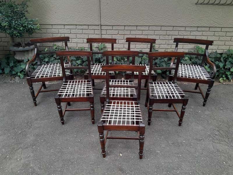 A 19th Century Set of Eight Cape Stinkwood Dining Charis with Riempie Seat Comprising Two Carvers...