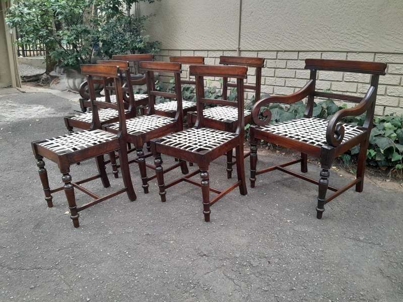 A 19th Century Set of Eight Cape Stinkwood Dining Charis with Riempie Seat Comprising Two Carvers...