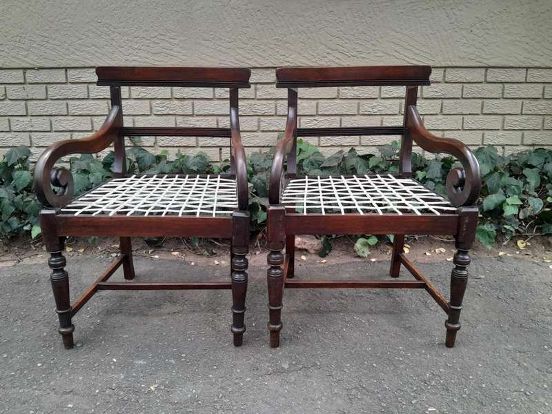 A 19th Century Set of Eight Cape Stinkwood Dining Charis with Riempie Seat Comprising Two Carvers...