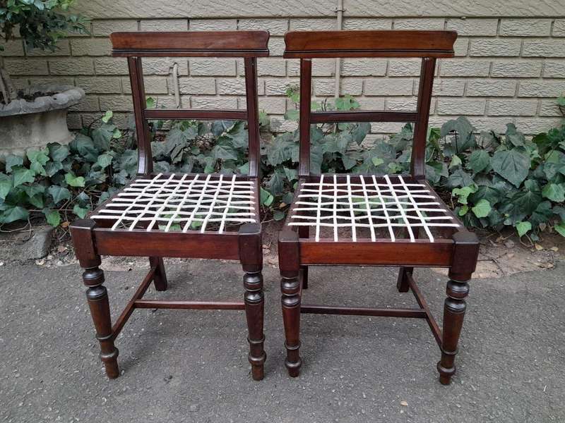 A 19th Century Set of Eight Cape Stinkwood Dining Charis with Riempie Seat Comprising Two Carvers...