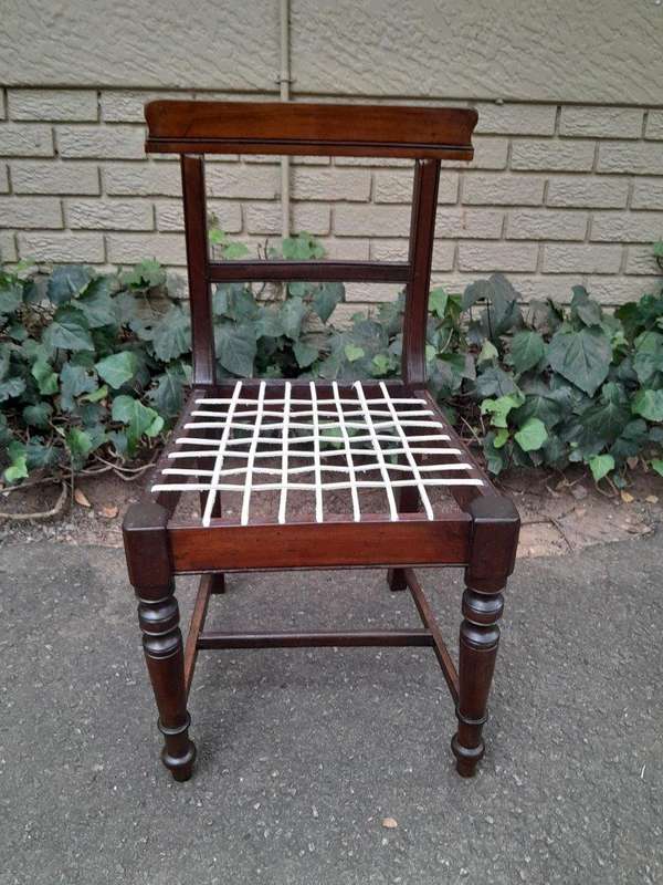 A 19th Century Set of Eight Cape Stinkwood Dining Charis with Riempie Seat Comprising Two Carvers...