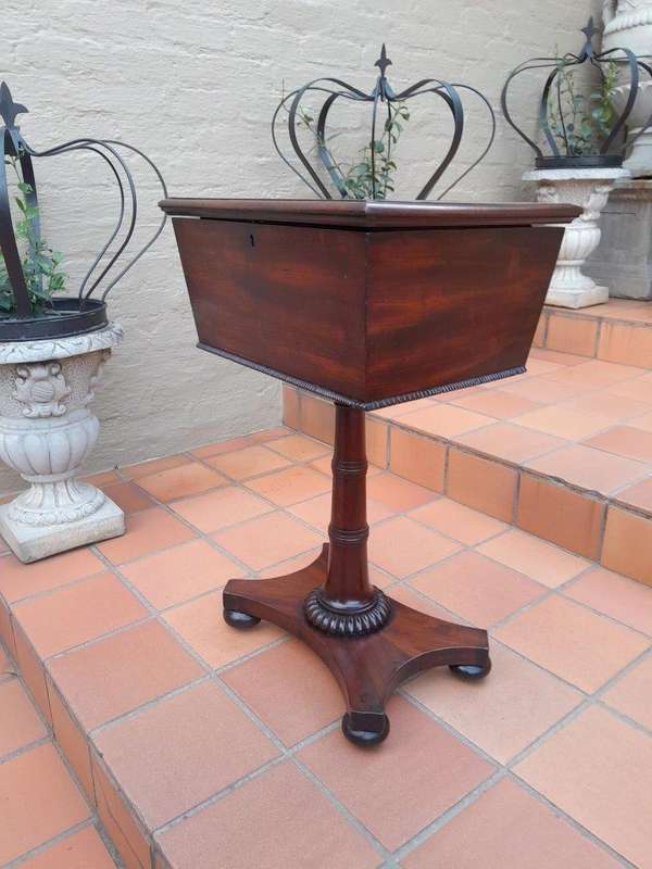 An Early 19th Century Regency Mahogany Tea Poy on Stand