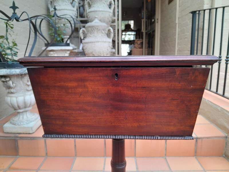 An Early 19th Century Regency Mahogany Tea Poy on Stand
