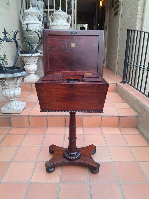 An Early 19th Century Regency Mahogany Tea Poy on Stand