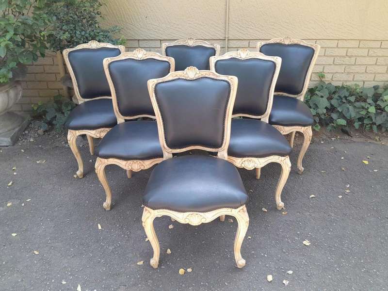 A 20th Set of Six French Style Dining Chairs in a Bleached Contemporary Finish and Upholstered in...