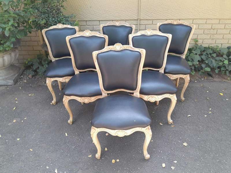 A 20th Set of Six French Style Dining Chairs in a Bleached Contemporary Finish and Upholstered in...