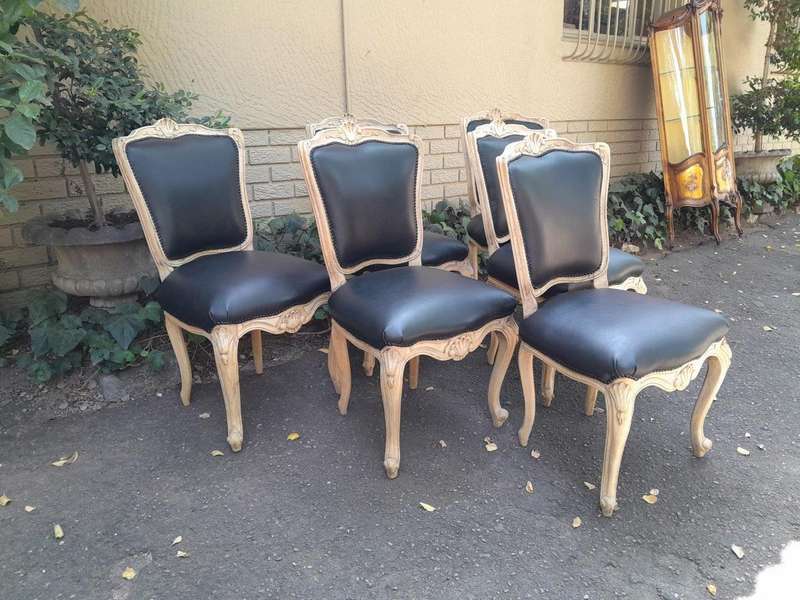 A 20th Set of Six French Style Dining Chairs in a Bleached Contemporary Finish and Upholstered in...