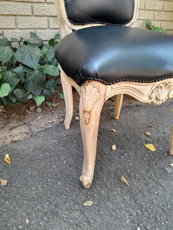 A 20th Set of Six French Style Dining Chairs in a Bleached Contemporary Finish and Upholstered in...