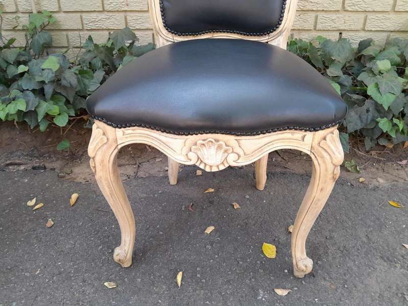 A 20th Set of Six French Style Dining Chairs in a Bleached Contemporary Finish and Upholstered in...