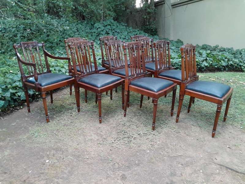 A 20th Century George III Hepplewhite Style Set of Ten Dining Chairs Comprising a Pair of Carvers...