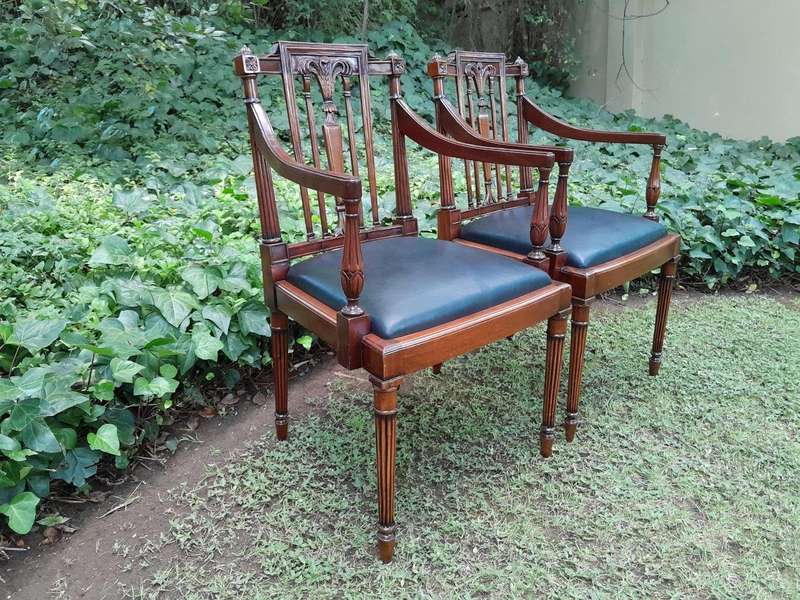 A 20th Century George III Hepplewhite Style Set of Ten Dining Chairs Comprising a Pair of Carvers...