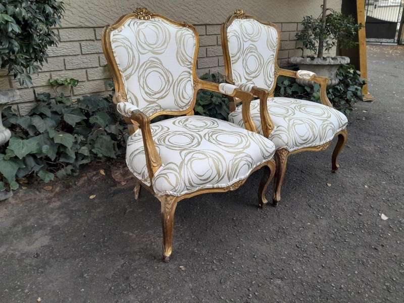 A 19th Century Pair of French Carved and Gilded Wooden Armchairs Upholstered in a Custom Made Fab...