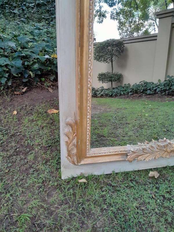 A 20TH Century French Style Carved, Gilded and Painted Mirror of Large Proportion