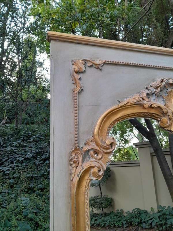 A 20TH Century French Style Carved, Gilded and Painted Mirror of Large Proportion