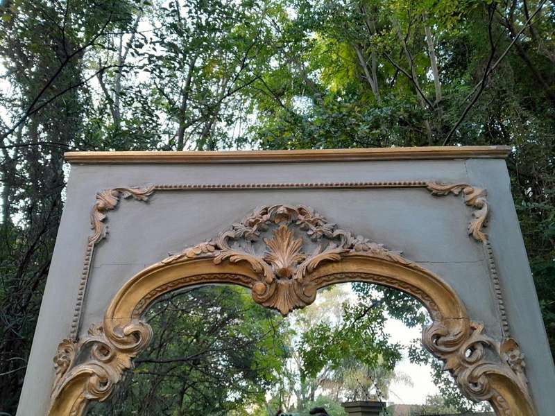 A 20TH Century French Style Carved, Gilded and Painted Mirror of Large Proportion