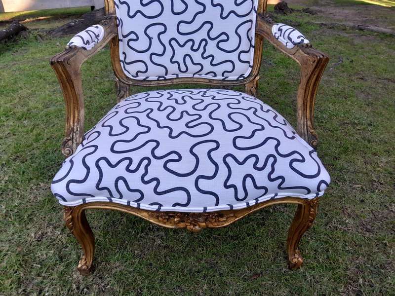A 20th Century French Style Ornately Carved And Gilded Wooden Armchairs