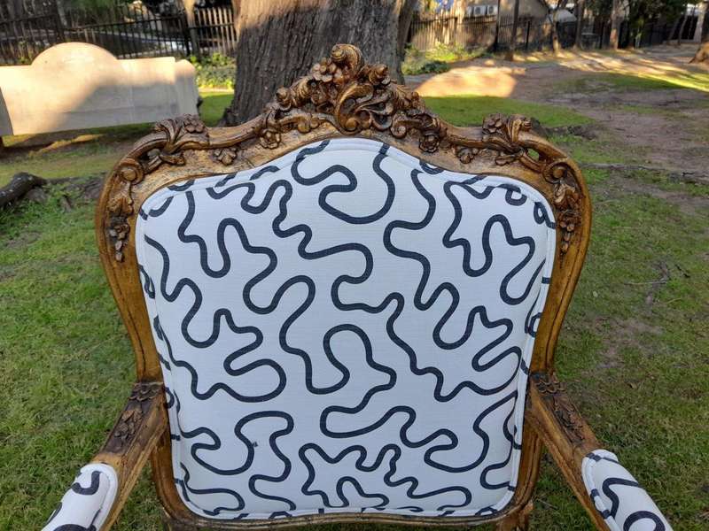 A 20th Century French Style Ornately Carved And Gilded Wooden Armchairs