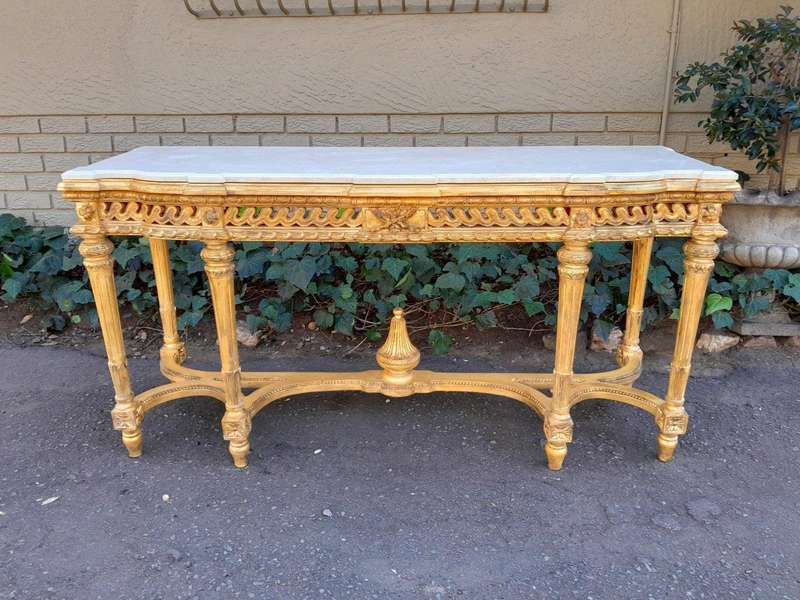 A 20th Century French Louis SVI Style Hand Gilded Console Table With Cream Marble Top