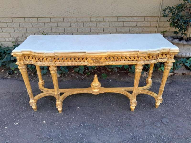 A 20th Century French Louis SVI Style Hand Gilded Console Table With Cream Marble Top