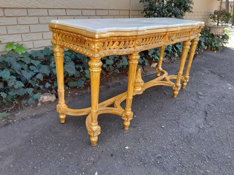 A 20th Century French Louis SVI Style Hand Gilded Console Table With Cream Marble Top