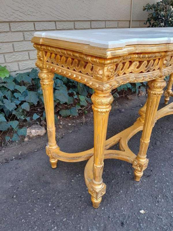 A 20th Century French Louis SVI Style Hand Gilded Console Table With Cream Marble Top