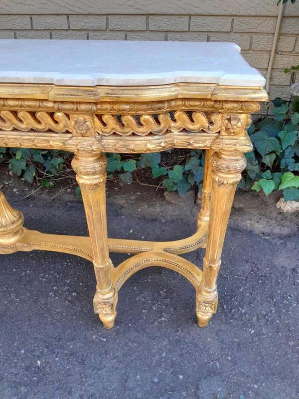 A 20th Century French Louis SVI Style Hand Gilded Console Table With Cream Marble Top