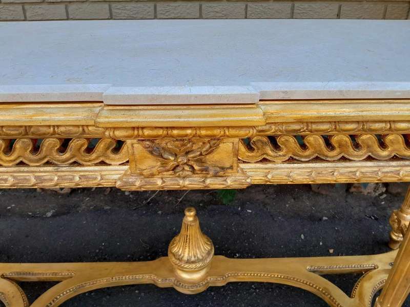 A 20th Century French Louis SVI Style Hand Gilded Console Table With Cream Marble Top