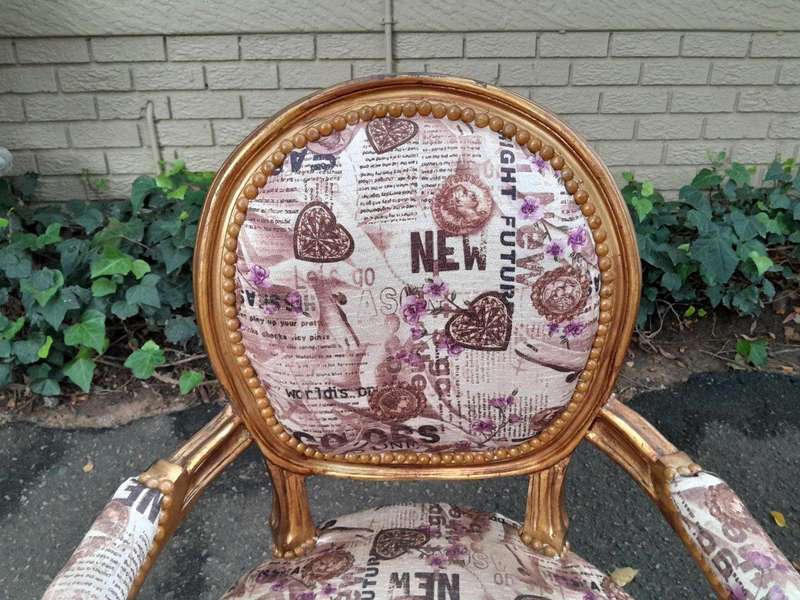 A 20th Century French Louis XVI Style Pair of Ornately Carved Gold Armchairs