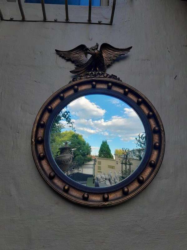 An Antique Regency Convex Eagle Mirror