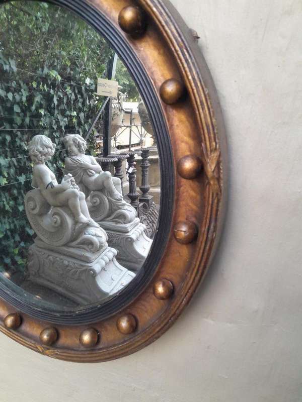 An Antique Regency Convex Eagle Mirror