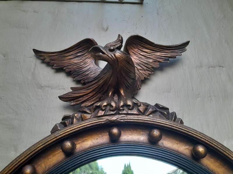 An Antique Regency Convex Eagle Mirror