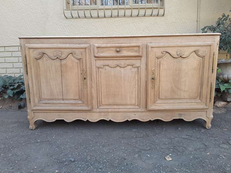 A 19th Century  Circa 1870 Carved Oak Side Board / Server With Drawer and Doors with Brass Mount...