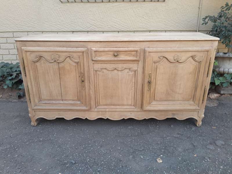 A 19th Century  Circa 1870 Carved Oak Side Board / Server With Drawer and Doors with Brass Mount...