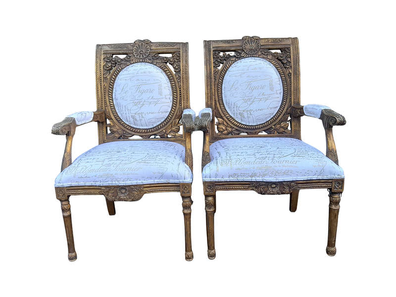 An Early 20th Century Pair Of French Louis Xiv Style Ornately Carved And Gilt Wooden Armchairs